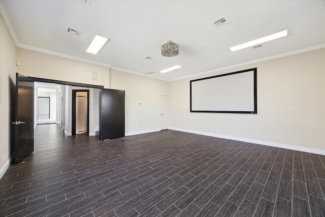 unfurnished room with crown molding, visible vents, and dark wood-type flooring