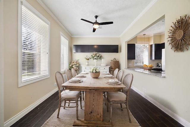 dining space featuring a ceiling fan, baseboards, ornamental molding, and dark wood-style flooring