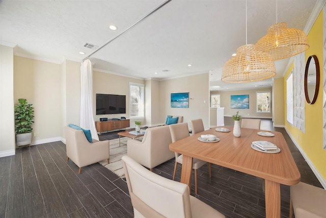 dining space featuring baseboards, recessed lighting, wood finished floors, and crown molding