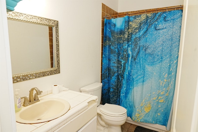 bathroom with tile patterned flooring, a shower with curtain, vanity, and toilet