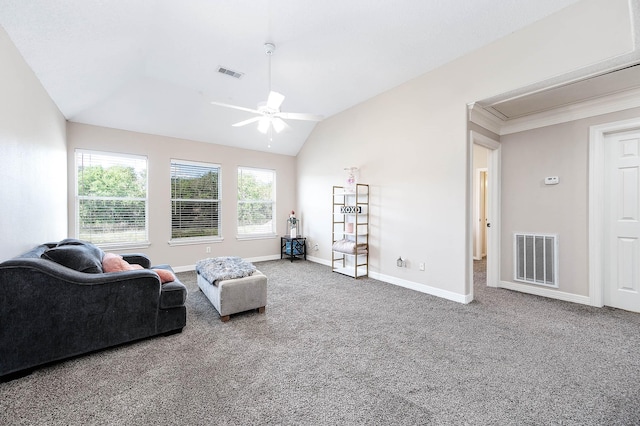 living room featuring ceiling fan, carpet floors, and vaulted ceiling