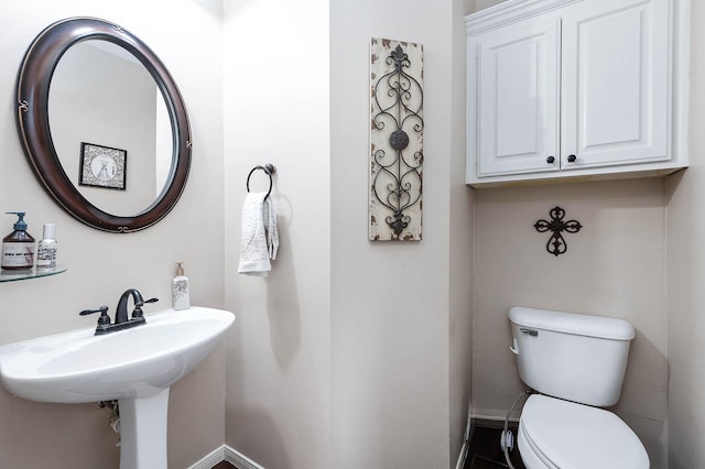 bathroom with sink and toilet