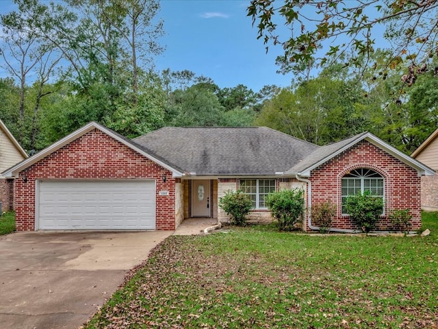 ranch-style home with a garage, brick siding, driveway, roof with shingles, and a front lawn