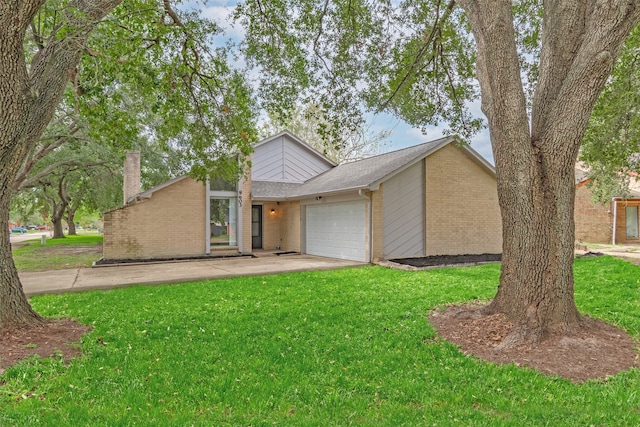 ranch-style house featuring a front yard and a garage