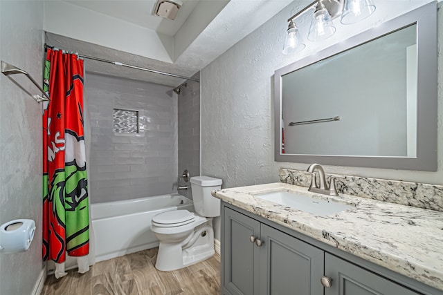 full bathroom with hardwood / wood-style flooring, vanity, toilet, and shower / bathtub combination with curtain