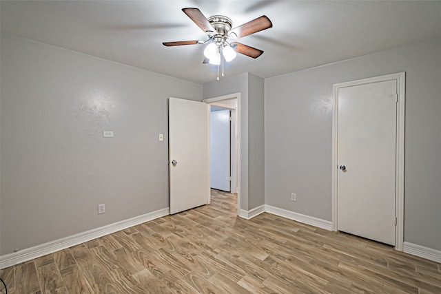 unfurnished bedroom featuring light hardwood / wood-style flooring and ceiling fan