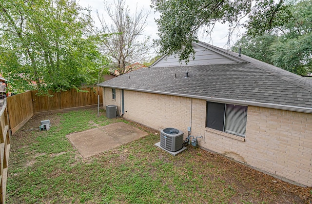 rear view of property with central air condition unit