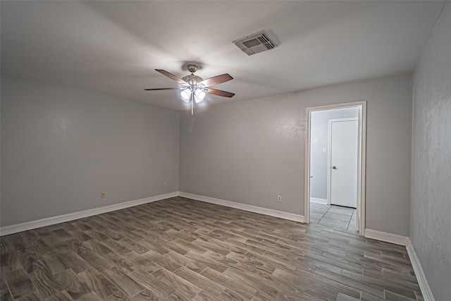 unfurnished room featuring hardwood / wood-style floors and ceiling fan