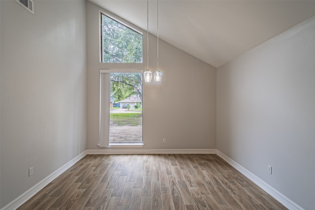 bonus room with high vaulted ceiling and hardwood / wood-style flooring