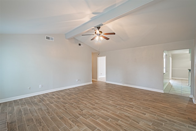 empty room featuring wood-type flooring, vaulted ceiling with beams, and ceiling fan