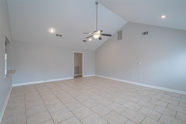 tiled empty room featuring ceiling fan and high vaulted ceiling