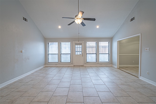 unfurnished room featuring light tile patterned floors, high vaulted ceiling, ceiling fan, and a healthy amount of sunlight