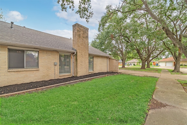 view of property exterior featuring a lawn