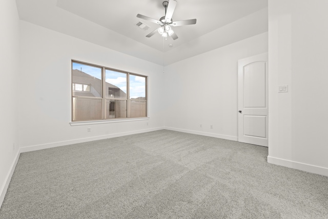 spare room with ceiling fan and carpet floors