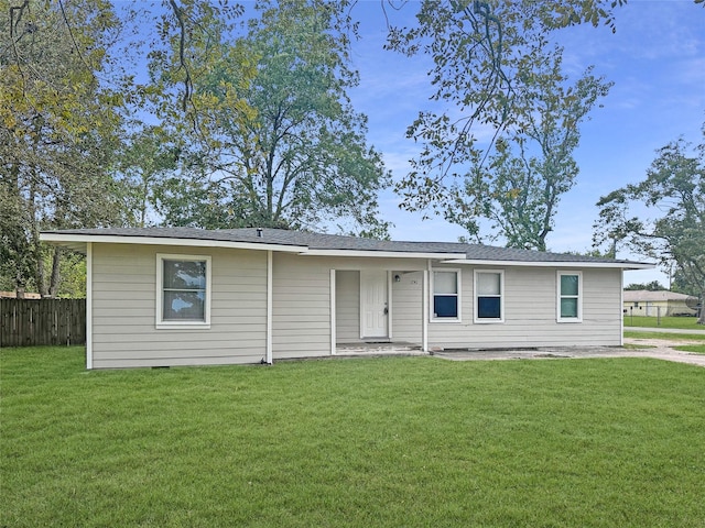 ranch-style home with a front lawn