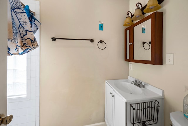 bathroom with vanity and toilet