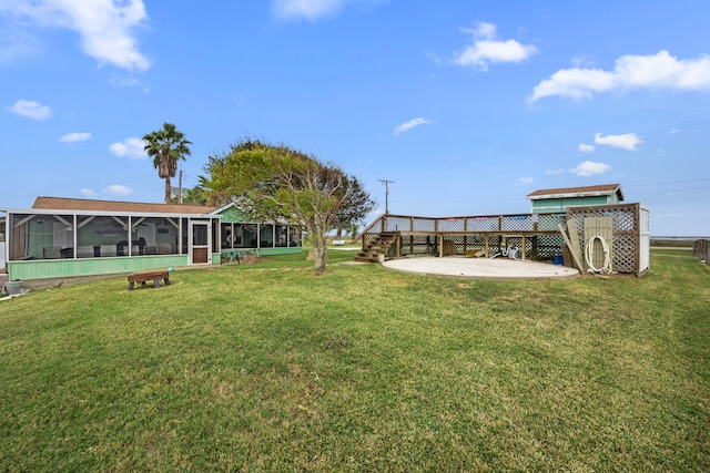 view of yard with a patio area and a sunroom