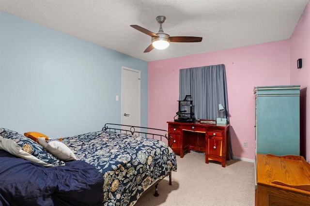 carpeted bedroom with a textured ceiling and ceiling fan