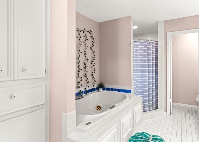 bathroom featuring toilet, a textured ceiling, tile patterned floors, and independent shower and bath