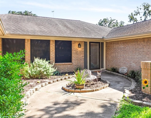 doorway to property with a patio area