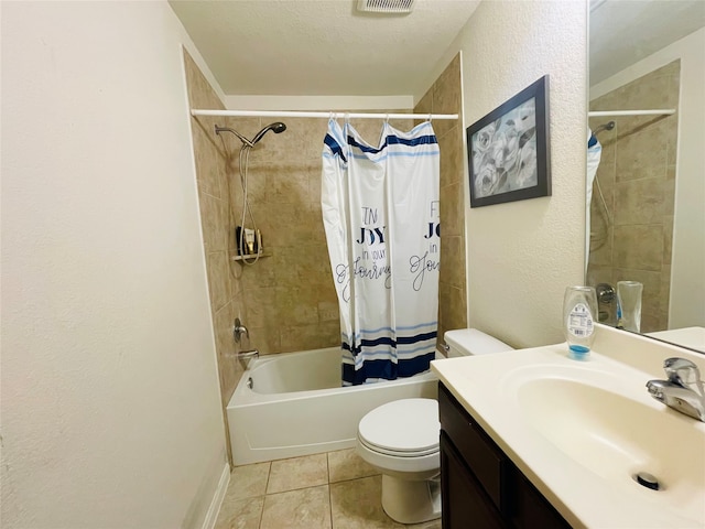 full bathroom with tile patterned floors, shower / bath combination with curtain, a textured ceiling, toilet, and vanity