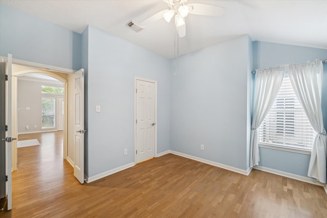 unfurnished bedroom with ceiling fan, light hardwood / wood-style floors, and vaulted ceiling