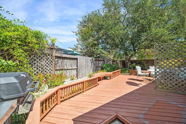 wooden deck with grilling area