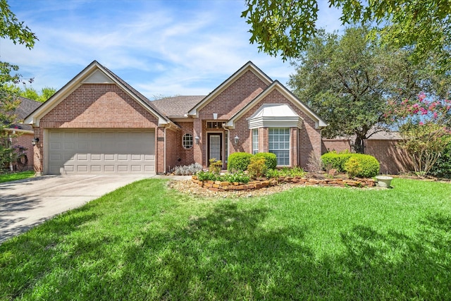 view of front facade with a front yard and a garage