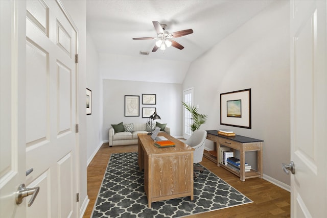 office area with vaulted ceiling, ceiling fan, and dark wood-type flooring