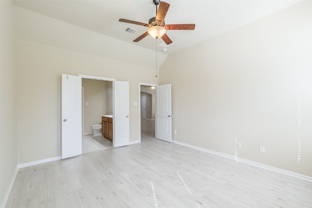 unfurnished bedroom with light wood-type flooring, high vaulted ceiling, ensuite bath, and ceiling fan