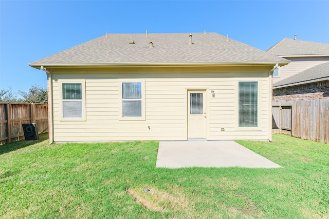 back of house featuring a yard and a patio