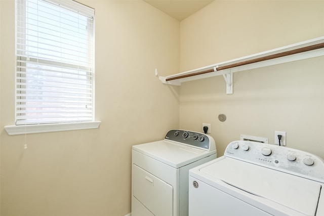 laundry room with washer and dryer