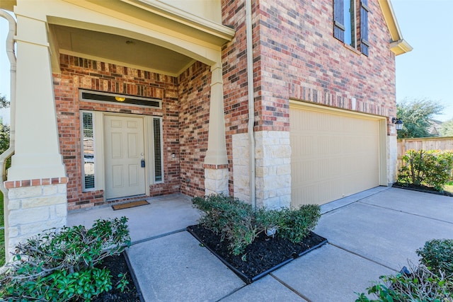 entrance to property featuring a garage