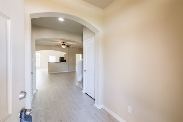 corridor with light hardwood / wood-style flooring