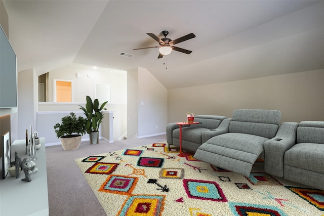 interior space featuring ceiling fan, lofted ceiling, and light carpet