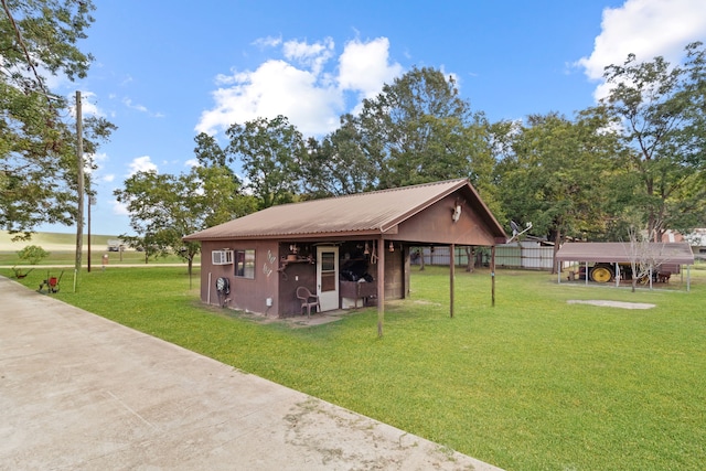 view of front facade with a front lawn and an outdoor structure