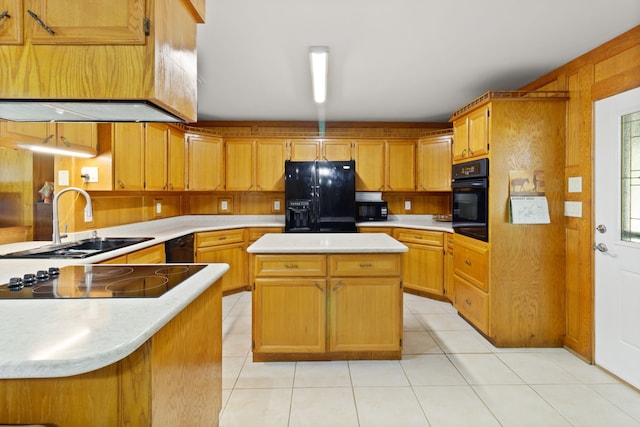 kitchen featuring black appliances, sink, light tile patterned floors, a kitchen island, and kitchen peninsula