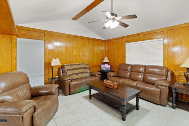 tiled living room with wood walls, ceiling fan, and vaulted ceiling