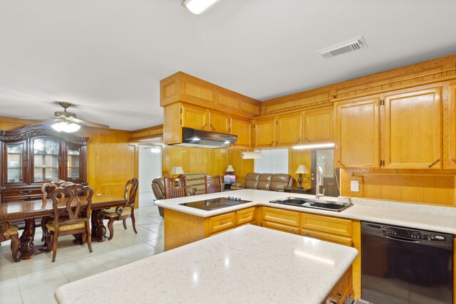 kitchen with kitchen peninsula, ceiling fan, sink, black appliances, and light tile patterned floors