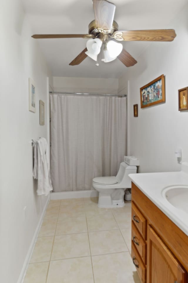 bathroom with ceiling fan, curtained shower, tile patterned floors, toilet, and vanity