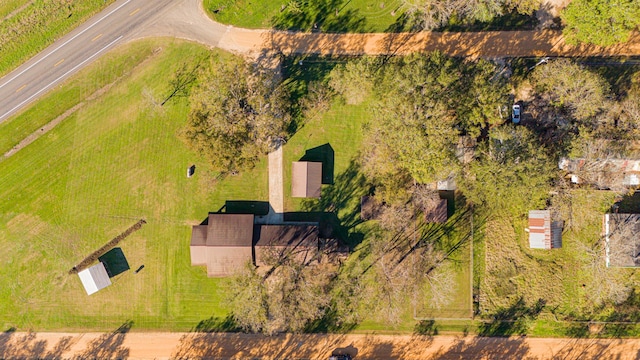 birds eye view of property with a rural view