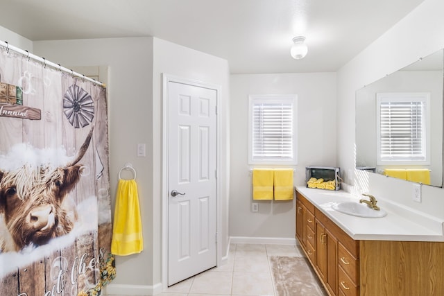 bathroom featuring tile patterned flooring and vanity