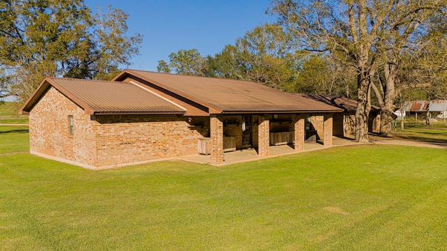 view of home's community with a patio area and a yard