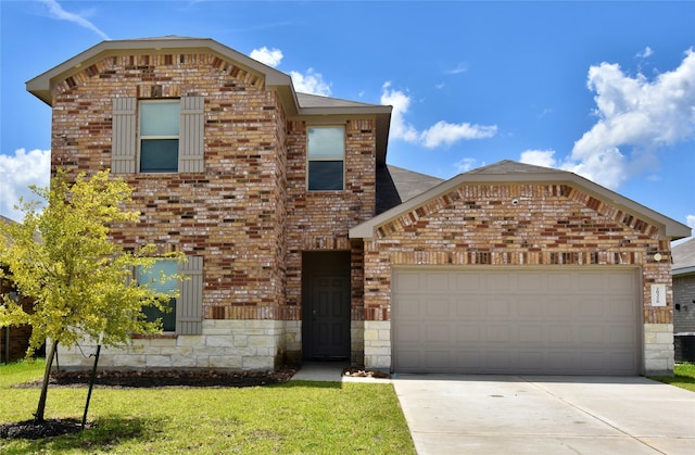 front facade with a garage and a front lawn