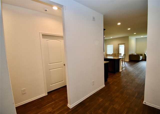 hall with dark hardwood / wood-style floors