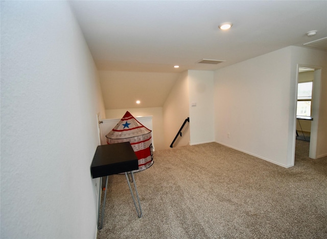 rec room with lofted ceiling and carpet flooring