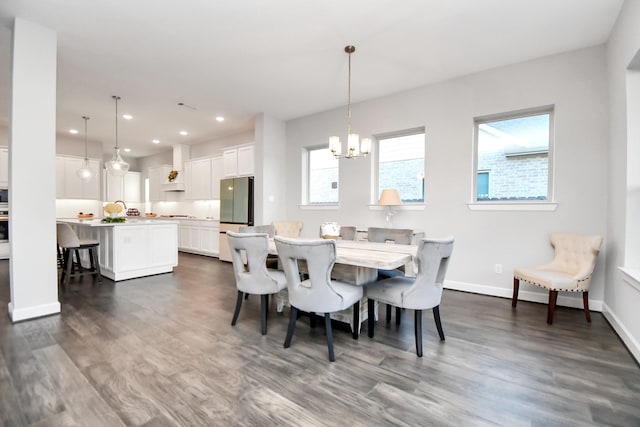 dining space with a chandelier, dark hardwood / wood-style flooring, and a healthy amount of sunlight