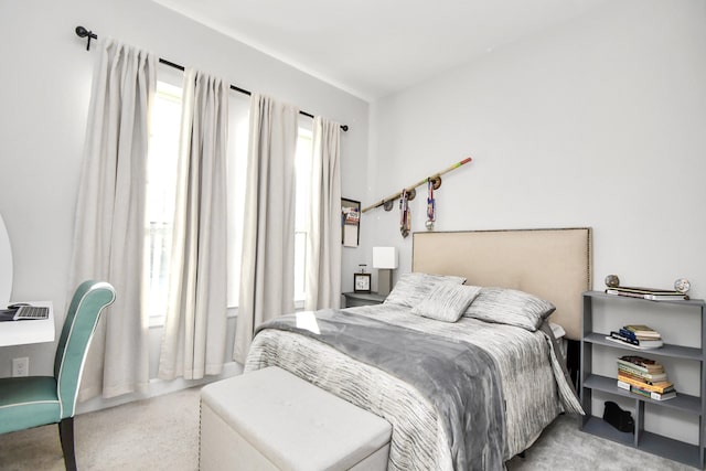 bedroom with light colored carpet