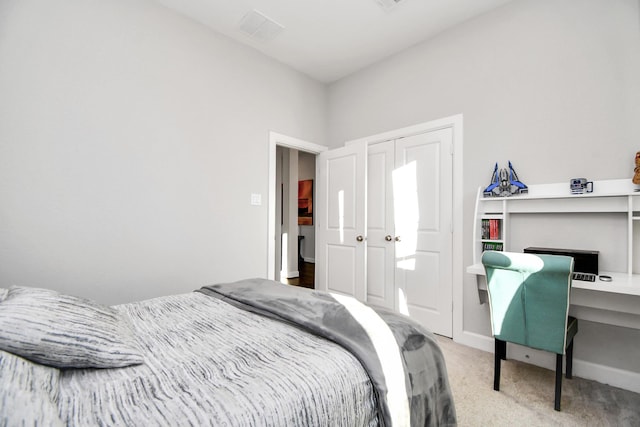 carpeted bedroom with a closet