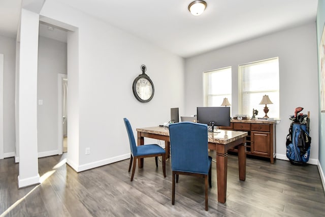 dining space featuring dark hardwood / wood-style floors